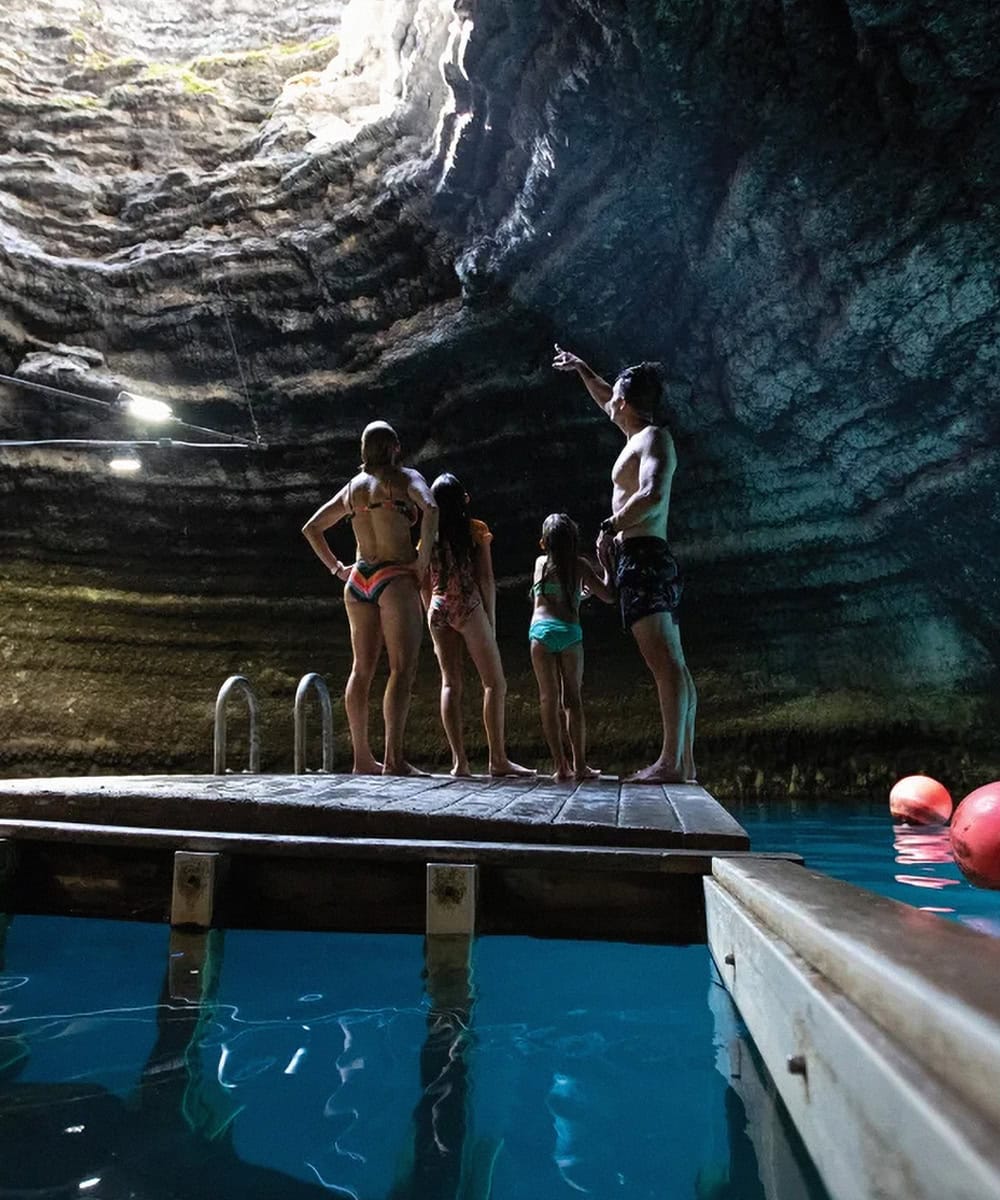 a family takes in the natural grandeur of The Crater in Midway, Utah